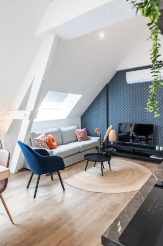 a living room with a couch and a fireplace at XL home 2BR near university and supermarket in Tilburg