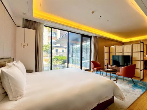 Katil atau katil-katil dalam bilik di Xiamen Lujiang Mingjia Hotel