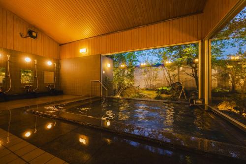 Πισίνα στο ή κοντά στο Ryokan Marumo