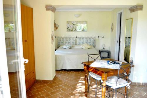 Cama o camas de una habitación en Hotel Tirrena Bike & Country Hotel