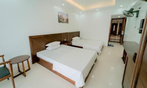Katil atau katil-katil dalam bilik di Hoa Hồng 1 Hotel SS by BAY LUXURY