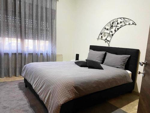 a bedroom with a bed with a lamp on it at GUSTO Apartment 2 in Orestiada
