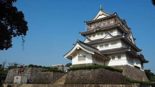 a large white building on top of a stone wall at Toyoko Inn Chiba Ekimae in Chiba