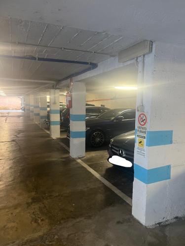 a parking garage with cars parked in it at Hotel Astoria in Torri del Benaco