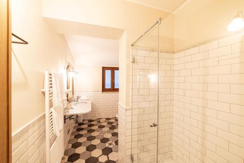 a bathroom with a shower and a sink at Agriturismo La Cerra in Tivoli