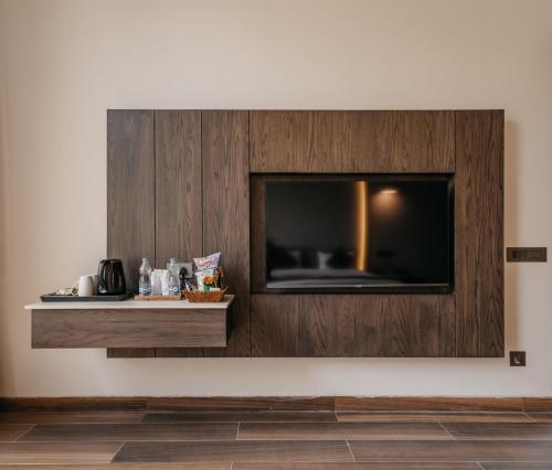 a flat screen tv on a wall in a room at Luxury Lofts in Amritsar