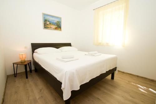 Ένα ή περισσότερα κρεβάτια σε δωμάτιο στο Vano Beach