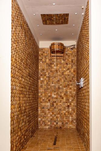 a hallway with a brick wall and a ceiling at Agriturismo La Cerra in Tivoli