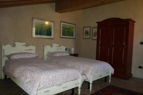 Ein Bett oder Betten in einem Zimmer der Unterkunft SacreTerre B&B e Agriturismo