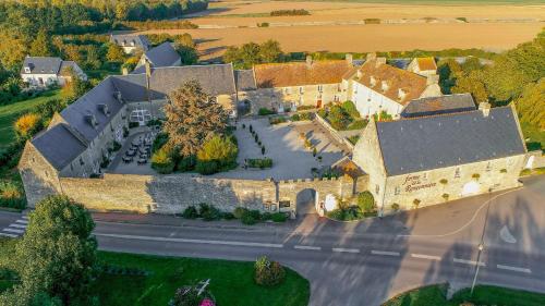 an aerial view of a large stone building at Ferme de la Rançonnière - Hôtel & Restaurant in Crépon