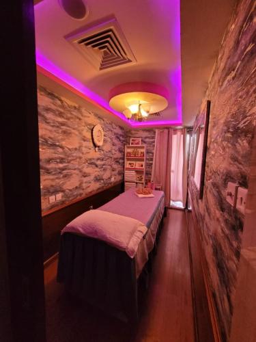 Ένα ή περισσότερα κρεβάτια σε δωμάτιο στο Fortune Pearl Hotel