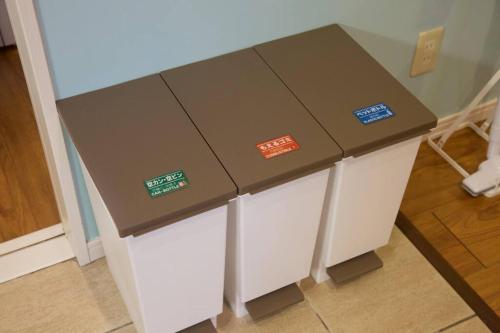 a table with stickers on it in a room at YAMASHIRO House in Ginowan