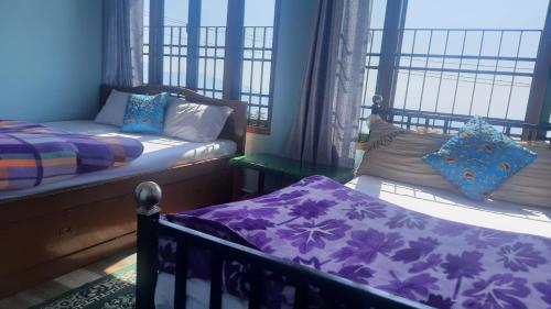 Postel nebo postele na pokoji v ubytování Kalimpong View Homestay