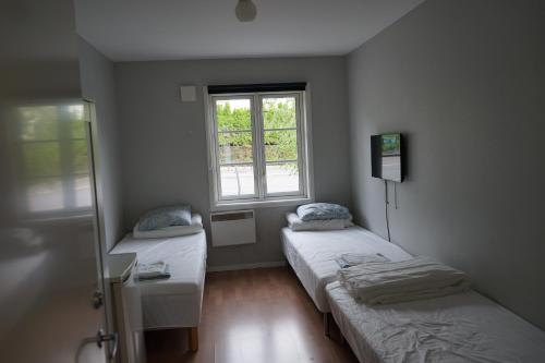 Postel nebo postele na pokoji v ubytování Home Express Oslo