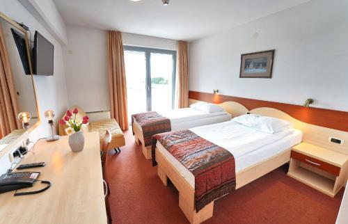 Hotel Krek Superiorにあるベッド