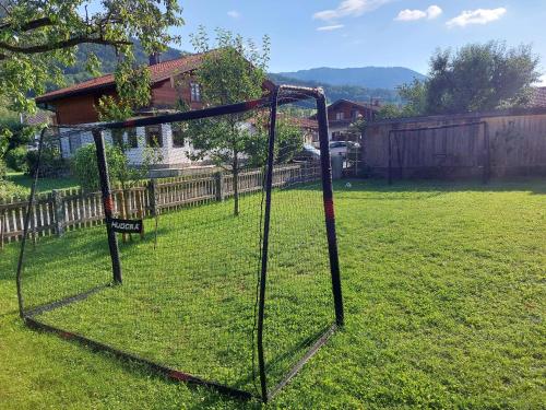 a batting cage in a yard with a house at Ferien by Wallners in Bad Feilnbach