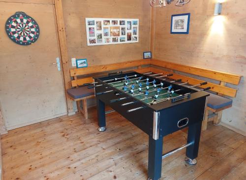 a large foosball table in a room at Ferien by Wallners in Bad Feilnbach