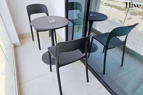 a group of chairs and tables in a room at 7 By Aurora 101 in Dubai
