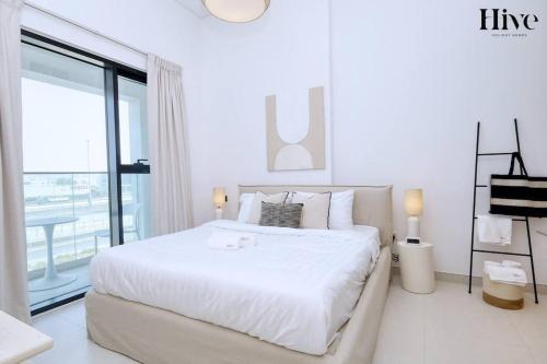 Giường trong phòng chung tại 7 By Aurora 201