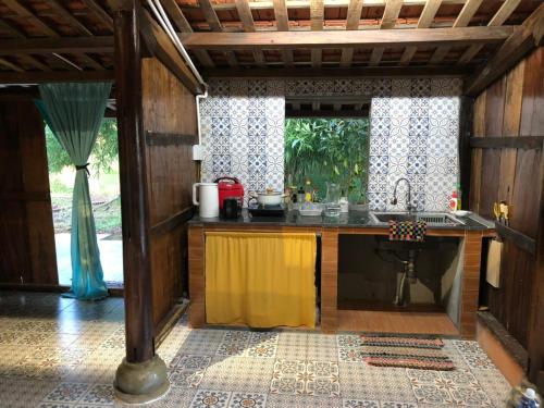 a kitchen with a sink and a counter top at Thôn Hoa Sen in Thôn Xuân Lỗ