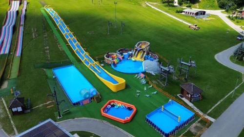 an aerial view of a playground with a water park at Chalet Prestige in Valča