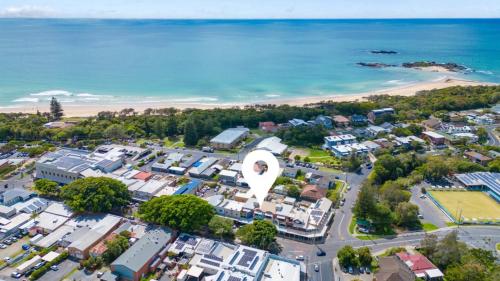 an aerial view of a city with a large white sculpture at Lindy Lou's - Village at Doorstep, Restaurants in Sawtell