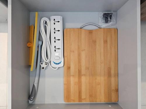 a cabinet with a remote control and other office supplies at 7 by Aurora 207 in Dubai