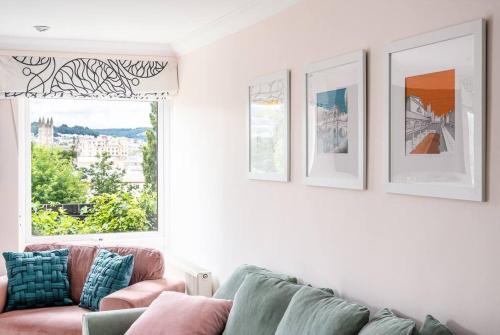 a living room with a couch and a window at Stunning 4 Bedroom House in Central Bath in Bath
