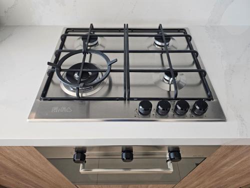 a stove top oven with a pot on top of it at 7 By Aurora 102 Jebel Ali in Dubai