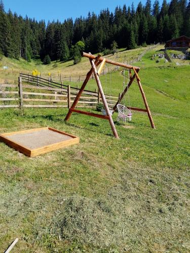 a basketball hoop in a field with a net at къщи за гости Под звездите in Pamporovo