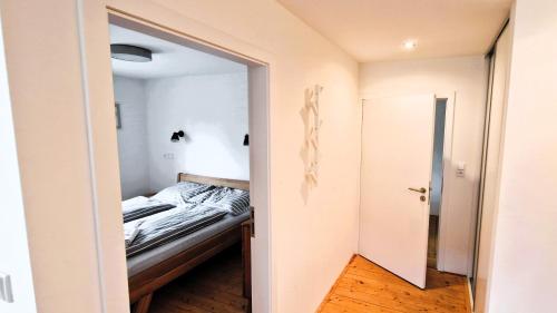 Una cama o camas en una habitación de Apartmány Včelín