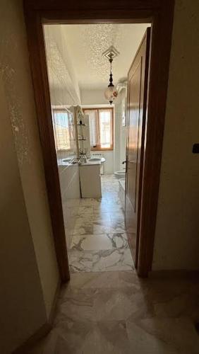 a hallway of a house with a room with a kitchen at Il borgo di Mefila, La casa in Corte in Scandriglia