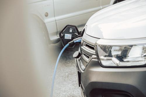 a car is hooked up to a charger at Ferienwohnen Mattle MIT IM RUCKSACK die SILVRETTA CARD PREMIUM in Kappl