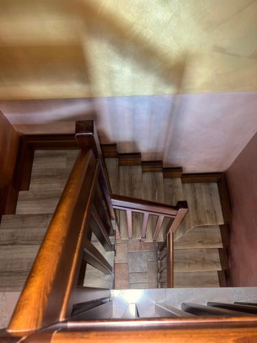 a spiral staircase in a building with a wooden floor at Bacio del sole Apartment in Palermo