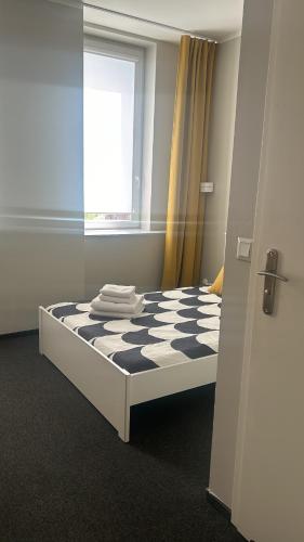 Postel nebo postele na pokoji v ubytování BYTOM SQUARE