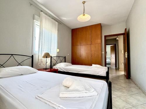 Postel nebo postele na pokoji v ubytování Mina Apartments 3 Nea Kallikrateia