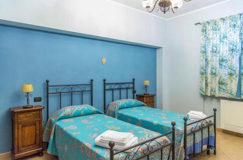 Postel nebo postele na pokoji v ubytování B&b Sant'Andrea