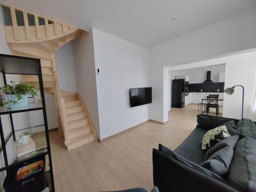 Televisyen dan/atau pusat hiburan di Duplex neuf à 15 min de LILLE