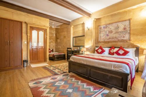 a bedroom with a large bed in a room at Naman Haveli-Boutique Stay For Budget Travllers in Jaisalmer