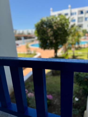 a blue railing with a tree in the background at Kabila vista in Sania Torres