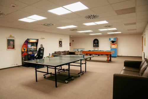 a room with a ping pong table and a ping pong ball at Vila Horec - depandance hotela Hubert Vital Resort in Vysoké Tatry