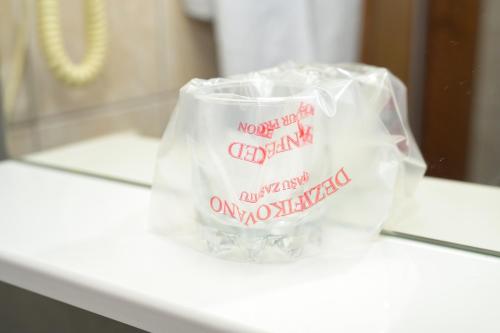 a bag with writing on it sitting on a counter at Motel Plaza in Jajce