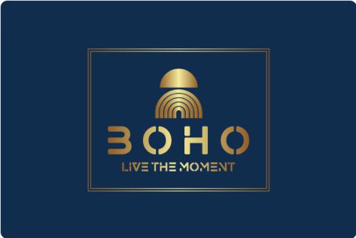 a sign that says live themovement with a gold bell at BATUU Luxury Living in Bizerte