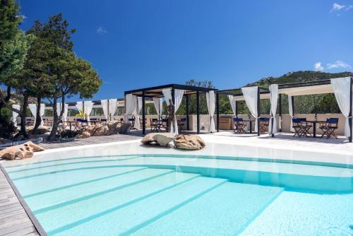 a swimming pool with a gazebo at Hotel delle Rose a Luxury Boutique Hotel in Porto Cervo