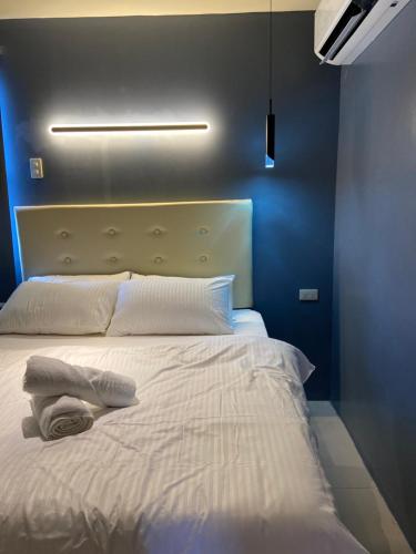 Postel nebo postele na pokoji v ubytování IAO Boutique Hotel