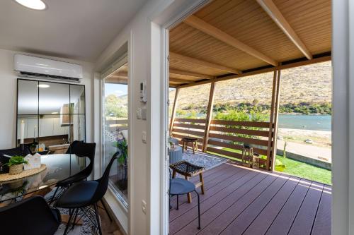 a house with a deck with a view of the ocean at Dream house by the sea in Grebaštica