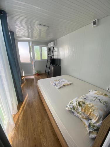 a bed with two pillows on it in a room at Casa Raul Eforie Sud in Eforie Sud