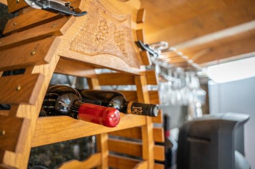 a row of wine glasses and wine bottles at Villa Lucija in Milna
