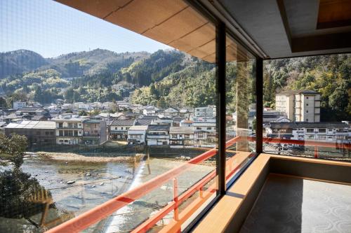a view of a city from the balcony of a building at Mansuirou in Misasa