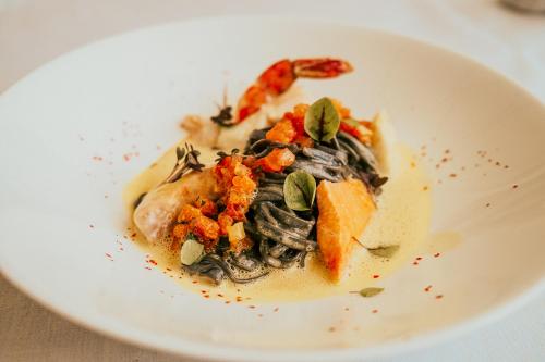 a plate of food on a white plate at Landgasthof Jagstmühle in Heimhausen